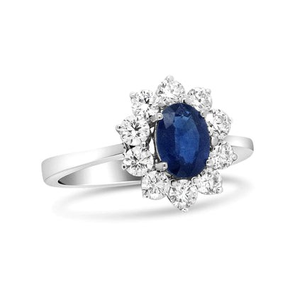 18K White Gold 7x5 mm Oval Cut Blue Sapphire and Round Diamond 3/4 Cttw Sunburst Halo Ring (F-G Color, VS1-VS2 Clarity)